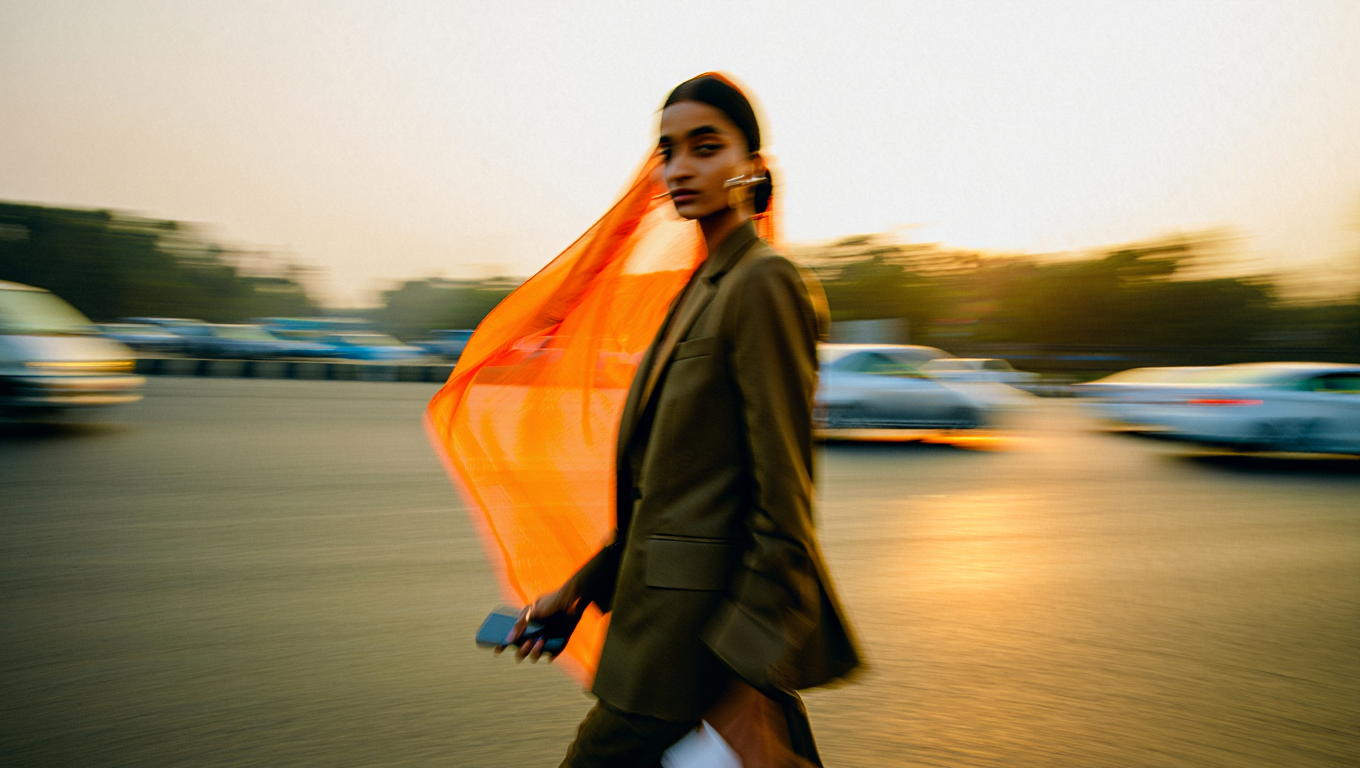 Woman with phone and money falling
